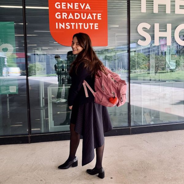 Donika with her school backpack in front of the Graduate Institute