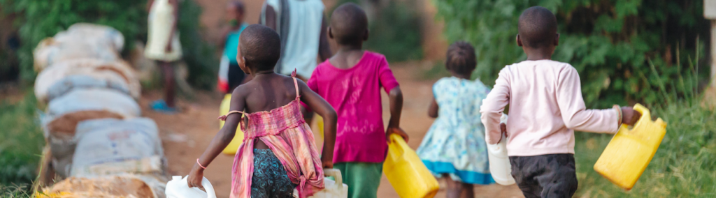 Uganda, children collecting water