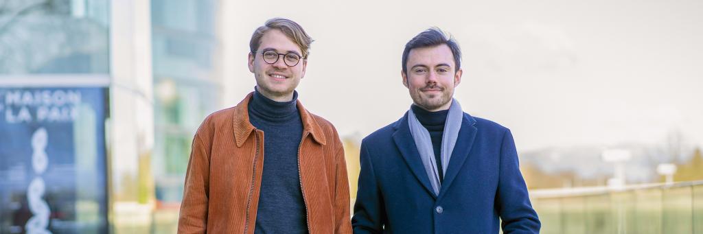 Students David and Emmanuel stand side by side, smiling