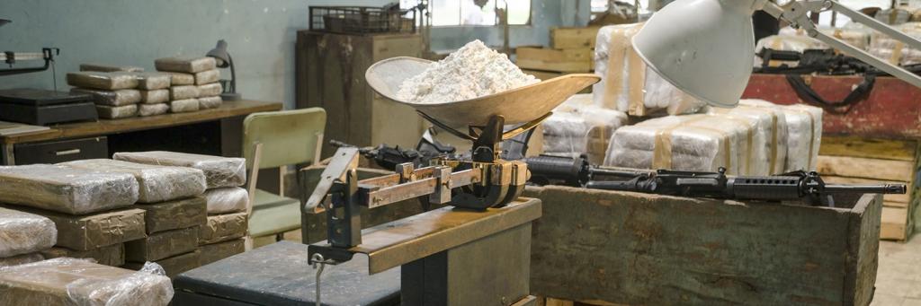 Packages of cocaine stacked in an empty warehouse