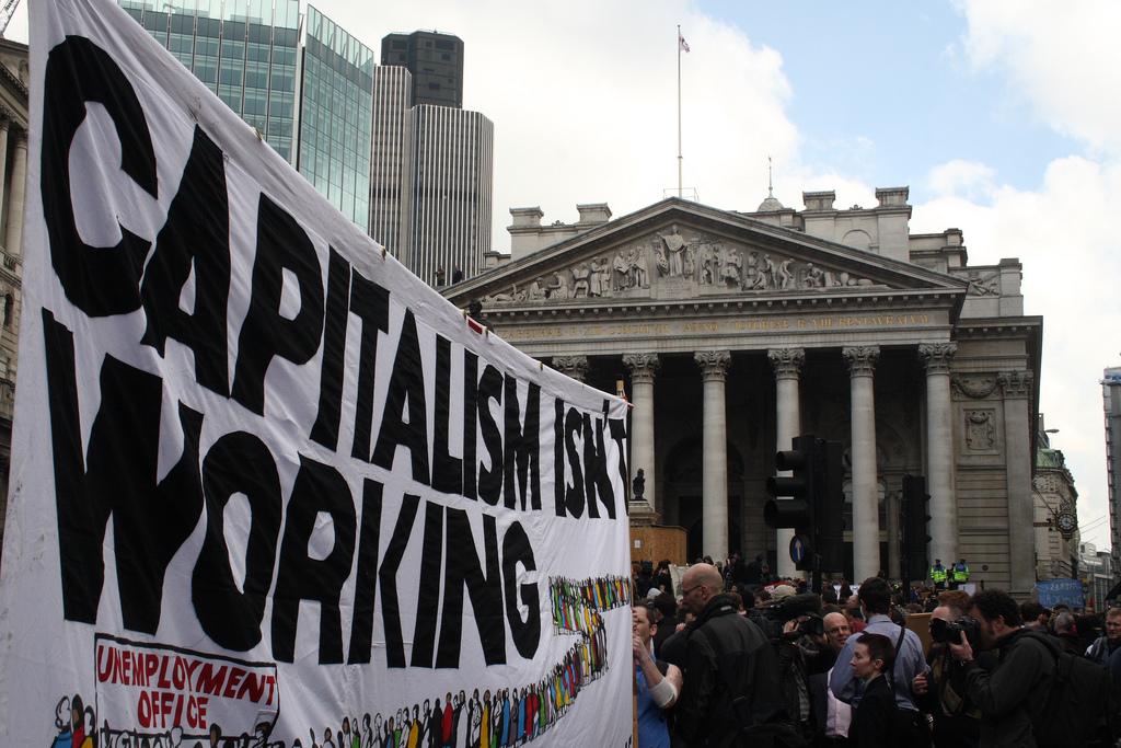 Demonstration sign that reads "Capitalism isn't working"