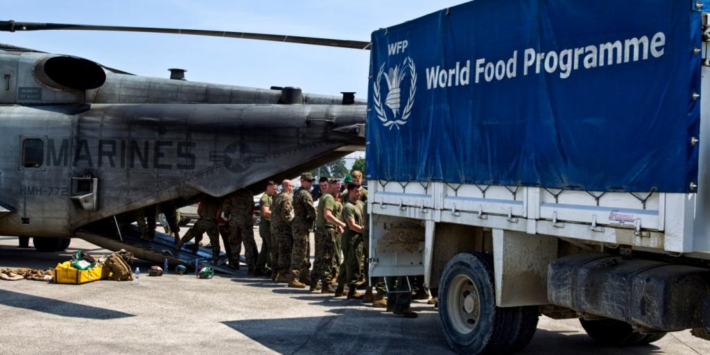 Marines loading a World Food Programme truck