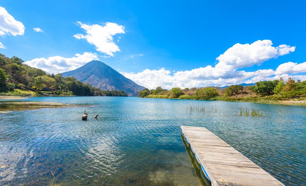 Beautiful bay of Lake Atitlan with view to Volcano San Pedro in highlands of Guatemala, travel destination in Central America