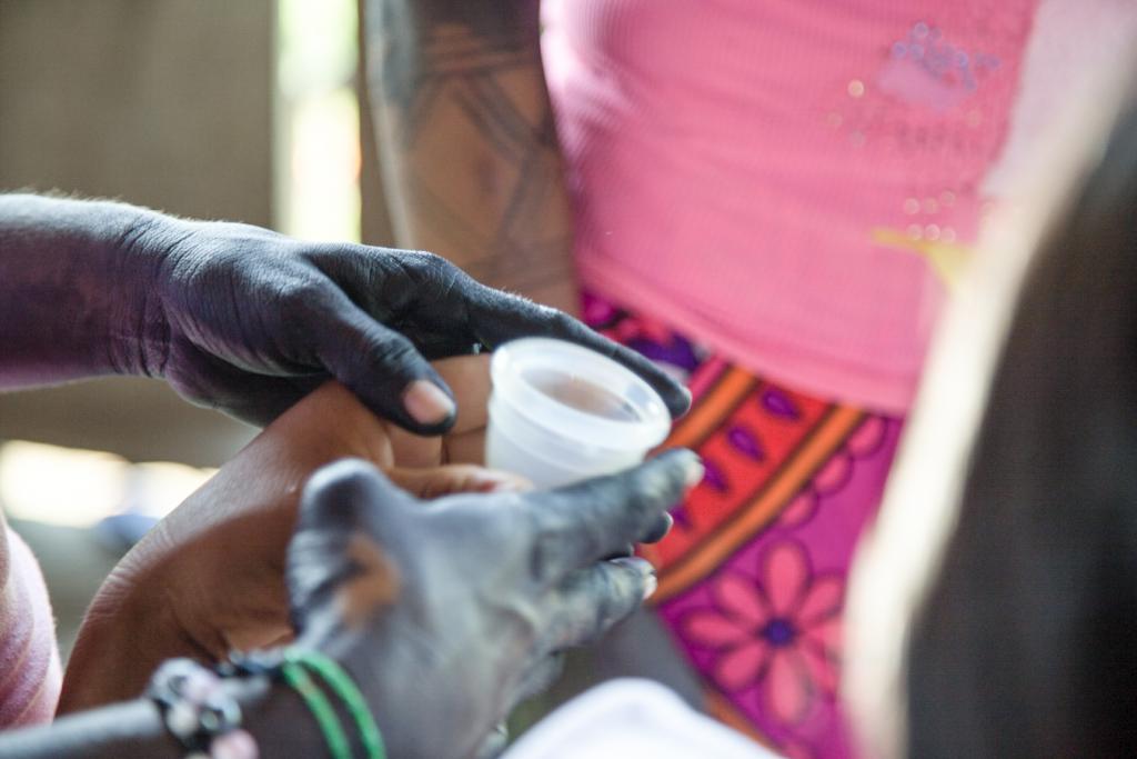 A menstrual cup is passed around during a women's circle in an Embera-Chamii village near Riosucio, Chocó, Colombia.