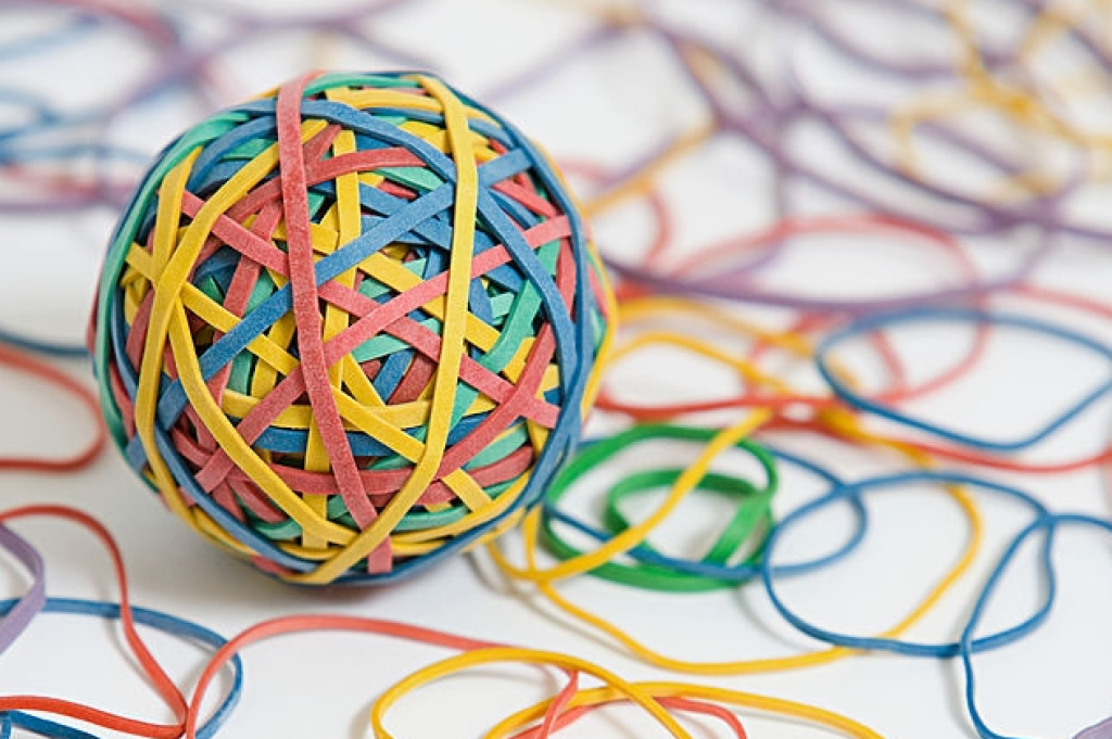 ball of entangled colorful elastic rubber bands
