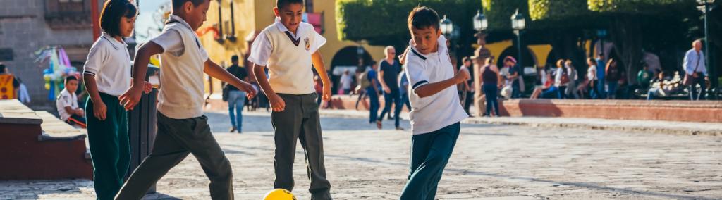 Kids playing football soccer in San Miguel de Allende, Mexico.