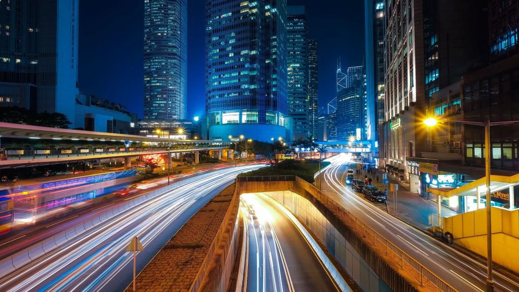 A night scene with a highway and city lights