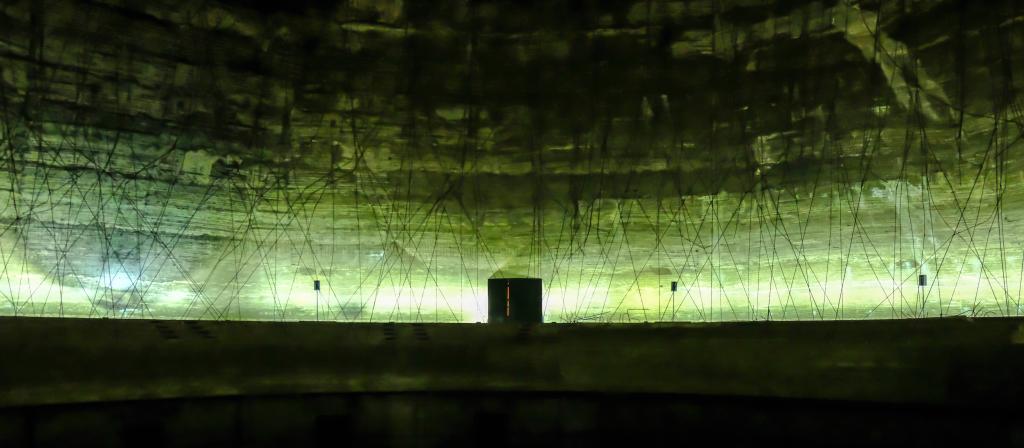 interior of a concrete monument is a green background
