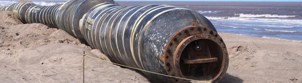Abandoned gas pipeline on a coastline