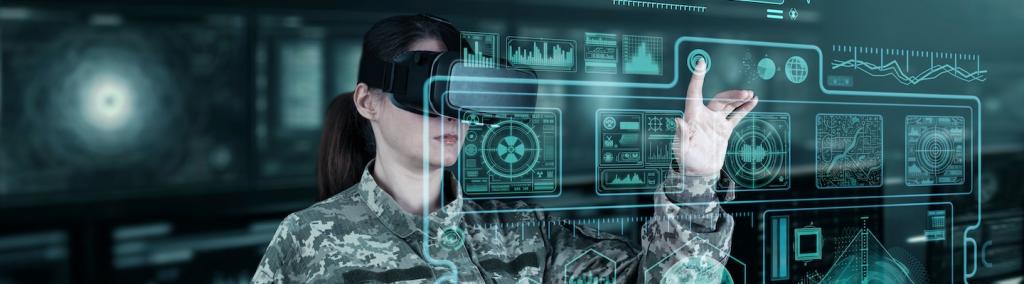 Female war analysis operator checking the coordination of the military team with a digital device.