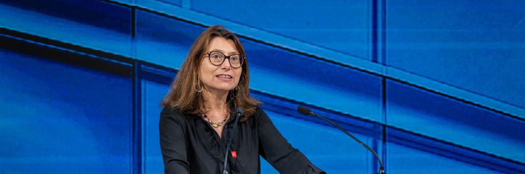 A photo of Marie-Laure Salles, Director of the Geneva Graduate Institute, speaking