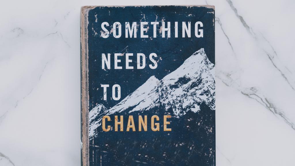an image of a mountain with the words "something needs to change" as an overlay