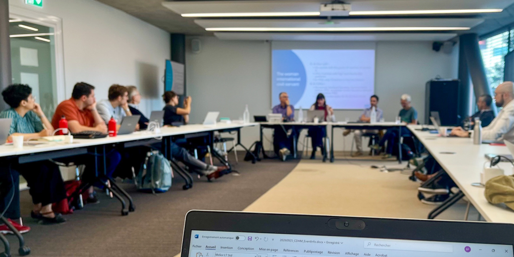 Photo of people at the seminar facing the speakers 