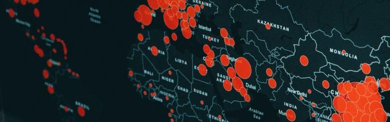 world map with red dots signalizing cases of COVID-19