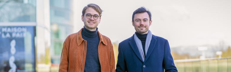 Students David and Emmanuel stand side by side, smiling