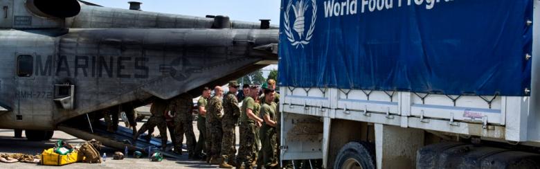 Marines loading a World Food Programme truck