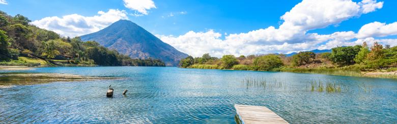 Beautiful bay of Lake Atitlan with view to Volcano San Pedro in highlands of Guatemala, travel destination in Central America