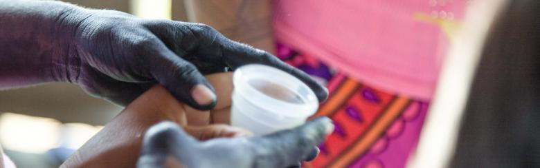 A menstrual cup is passed around during a women's circle in an Embera-Chamii village near Riosucio, Chocó, Colombia.