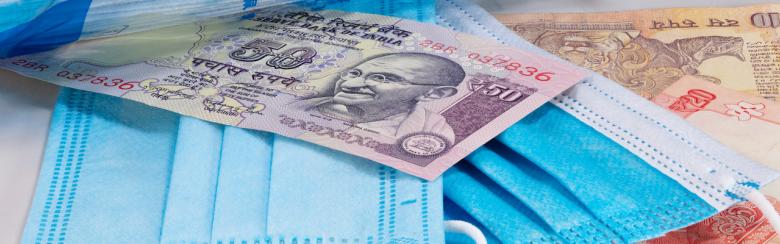 Face masks and Indian banknotes.