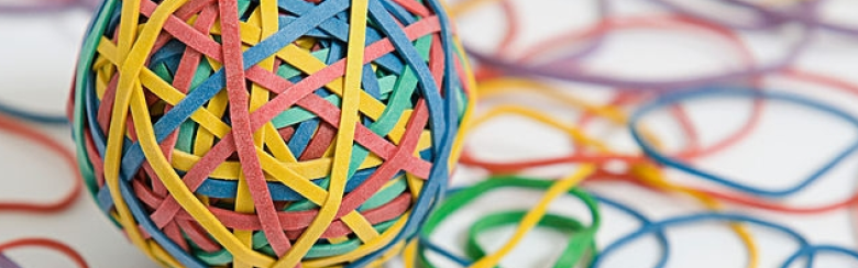 ball of entangled colorful elastic rubber bands