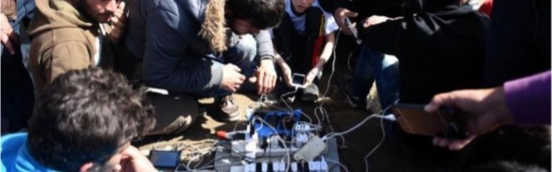 A team of Afghan Migrants conducting digital practices