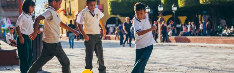 Kids playing football soccer in San Miguel de Allende, Mexico.