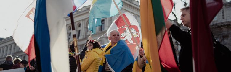 people and various flags from different nations