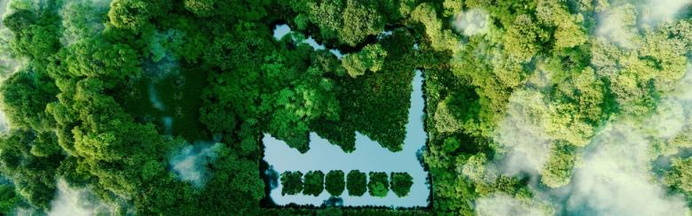Concept of environmentally friendly production: a pond shaped like a factory in the middle of a lush forest.