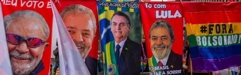 Street vendors sell towels and posters with the images of presidential candidates Luiz Inácio Lula da Silva and Jair Bolsonaro in São Paulo, Brazil, on 17 July 2022.