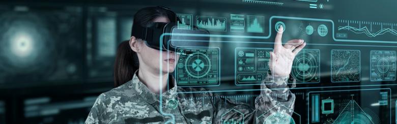 Female war analysis operator checking the coordination of the military team with a digital device.