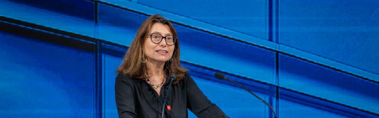 A photo of Marie-Laure Salles, Director of the Geneva Graduate Institute, speaking