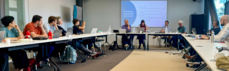 Photo of people at the seminar facing the speakers 